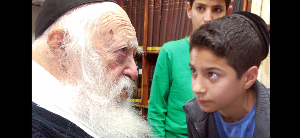 Rabbi Chaim Kanievsky, the foremost authority on Jewish law today, is an avid supporter of Zion Orphanage. Here he greets Zion boys at his home in Bnei Brak, Israel.