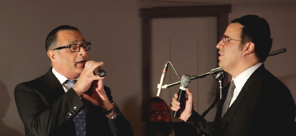 The popular Jewish singer, Yaakov Shwekey (R), appears at a Zion Orphanage event with Yechezkel Tzion (L), the world-renowned cantor who spent his formative years at Zion Orphanage.