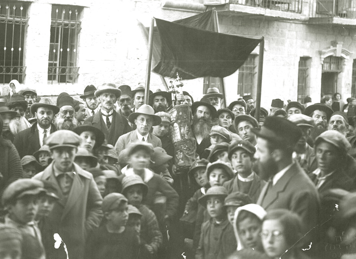 Celebrating the completion of the writing of a Torah scroll.