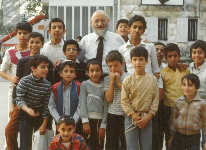 Zion boys with their surrogate father, Rabbi Rakovsky who directed Zion Orphanage from 1967-1997.