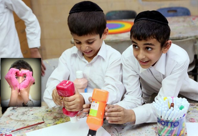 A couple of Zion boys are enjoying the art of finger painting.