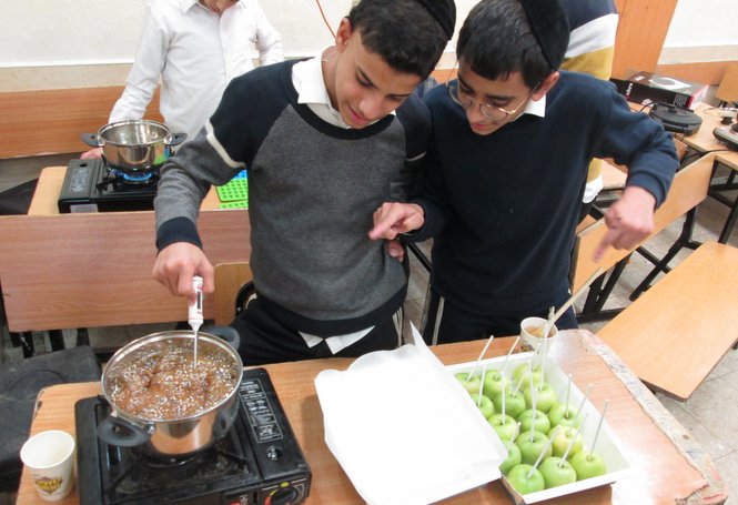 During this week's cooking course the Zion boys enjoyed making their own tasty caramel coate...