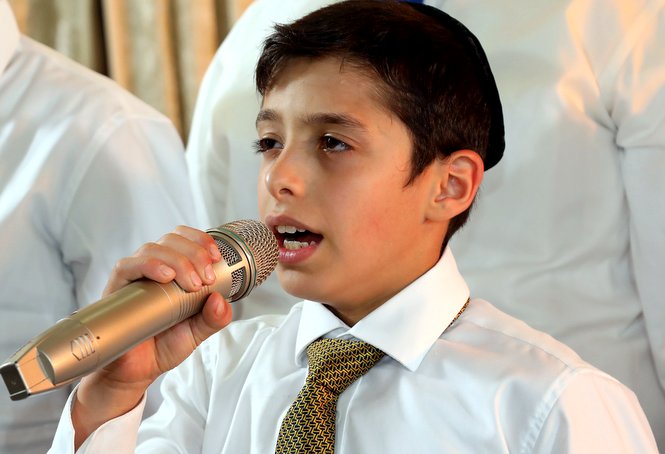 A Zion boy, whose beautiful voice was discovered by our choir instructor, is seen here singin...