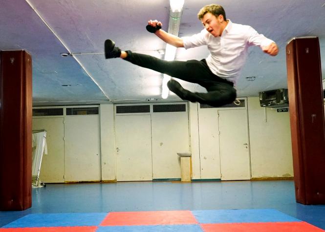 Pictured is one of the Zion boys practicing a move he learned in our martial arts program.