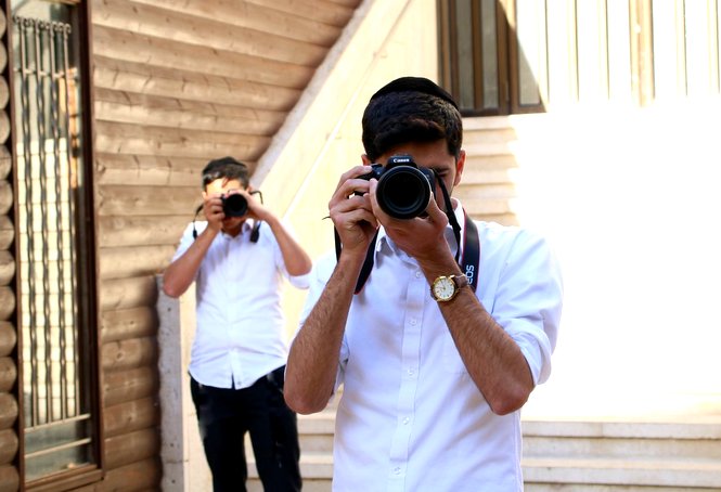 Blossoming photographers in our Zion photography program are captured during practice on campus.