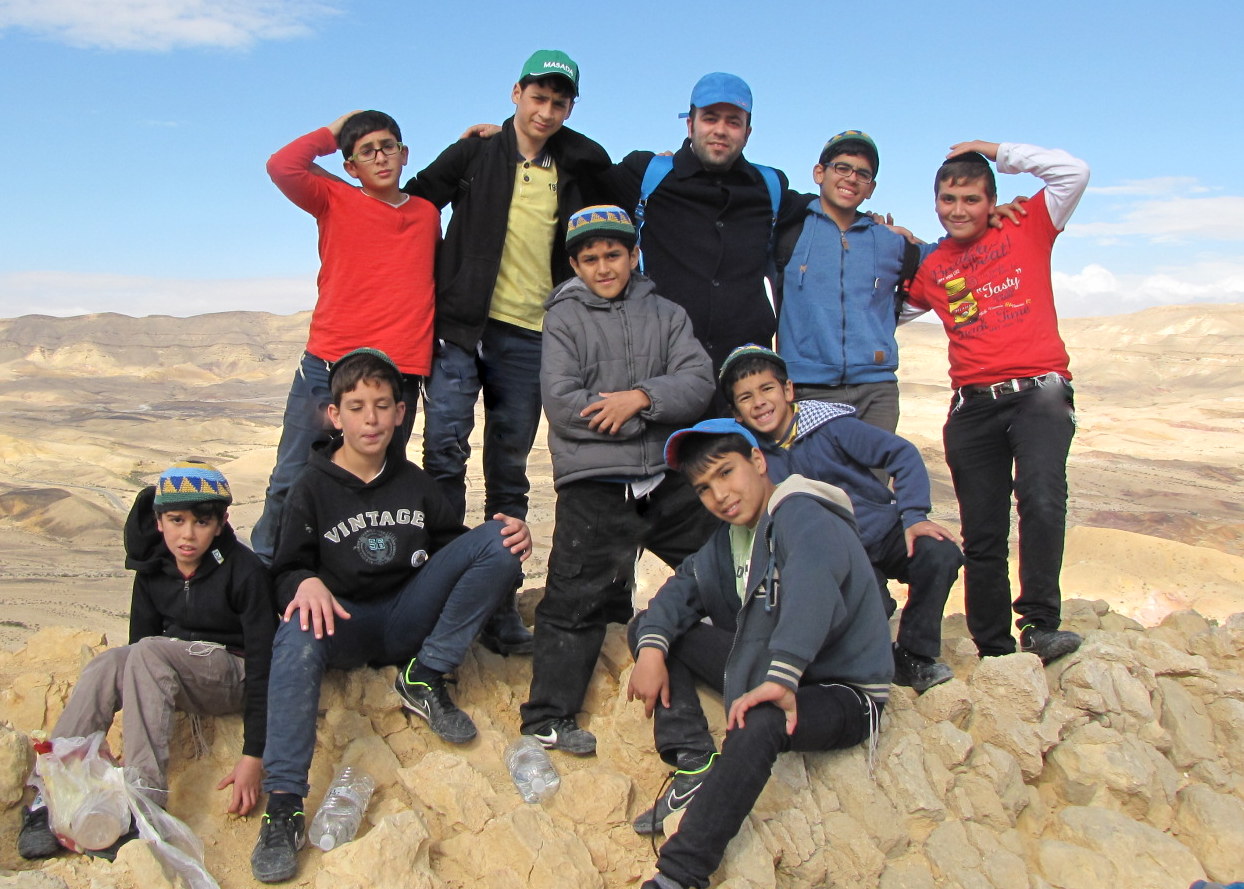 A group of Zion boys and their house father (av biyet) take advantage of the excellent weathe...